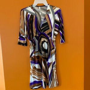 2/$25 Cristina love ladies dress in size small.  Brown, black and purple.